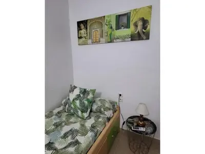 Cama o camas de una habitación en Cozy townhouse in Vera, just steps from the beach