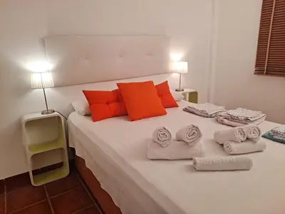 Cama o camas de una habitación en apartamento en urbanización nudista