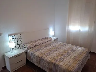 Cama o camas de una habitación en apartamento en urbanización nudista