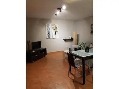 Una televisión o centro de entretenimiento en Apartment with large terrace in Almeria