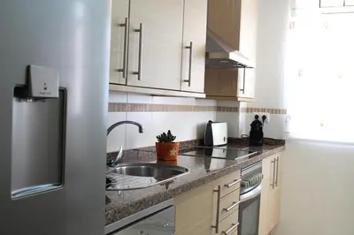 Una cocina o zona de cocina en Junto al Mar