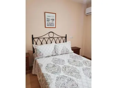 Cama o camas de una habitación en Beachfront apartment in Nautrist Resort