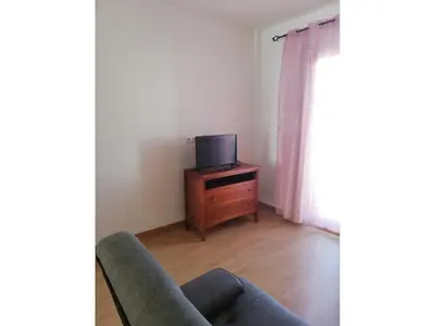 Una televisión o centro de entretenimiento en Apartment near Vera Naturist Beach