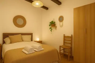 Cama o camas de una habitación en Casa del Agua - Escapada rural con chimenea y vistas a Sierra Nevada