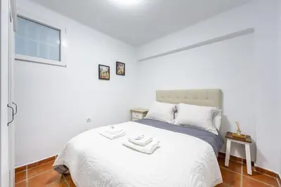 Cama o camas de una habitación en AlmeriaSuite Casa de Luz