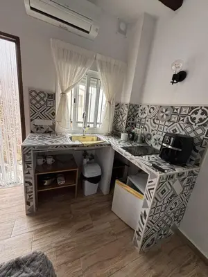 Una cocina o zona de cocina en El Tumbao con romántica bañera de hidromasaje para dos