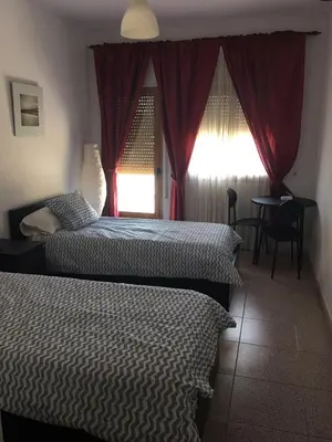 Cama o camas de una habitación en Hostal El Perejil