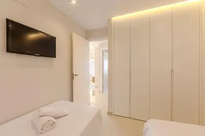 Cama o camas de una habitación en AlmeriaSuite Gran Bahia Playa