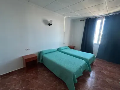 Cama o camas de una habitación en El Flamenco
