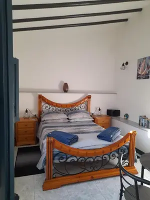 Cama o camas de una habitación en La Casita Perlita