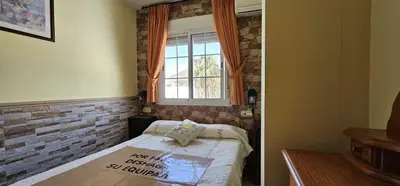 Cama o camas de una habitación en Apartamentos Wily y Mavi