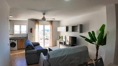 Una televisión o centro de entretenimiento en Apartalux Star Magic II