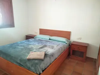 Cama o camas de una habitación en Apartamento con terraza