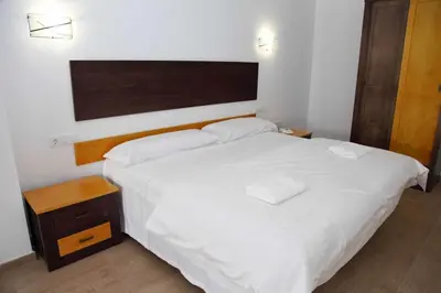 Cama o camas de una habitación en Hotel Lorenzo