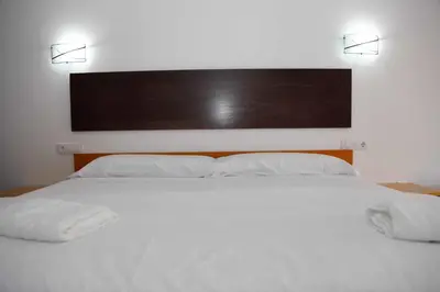 Cama o camas de una habitación en Hotel Lorenzo
