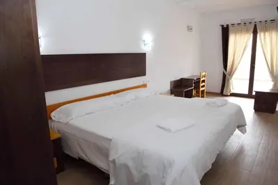 Cama o camas de una habitación en Hotel Lorenzo