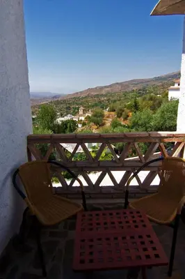 Un balcón o terraza de Holiday Home Gemütliches Haus in Anlage mit Pool und Garten by Interhome
