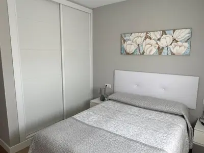 Cama o camas de una habitación en Horizonte Roquetas - Primera Línea de Playa con Vistas al Mar