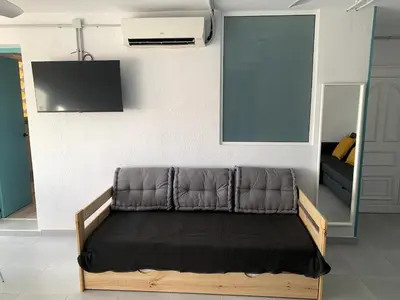 Una televisión o centro de entretenimiento en Apartamento en Zona de Playa