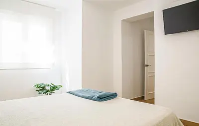 Una televisión o centro de entretenimiento en Lovely Apartment In Almeria With Wifi