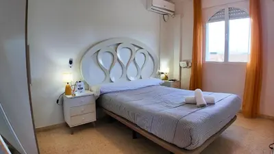 Cama o camas de una habitación en Apartalux Cielo Dorado