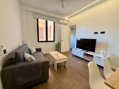 Una televisión o centro de entretenimiento en Suite Lorca centro