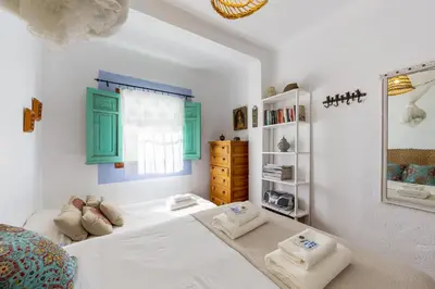Cama o camas de una habitación en AlmeriaSuite Casita de las Flores