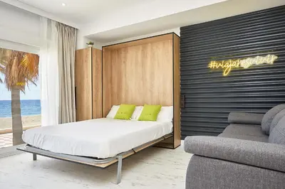 Zona de estar de Apartamentos Paseo Maritimo by Expoholidays 5 y 9