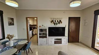Una televisión o centro de entretenimiento en Terreros Eden Retreat