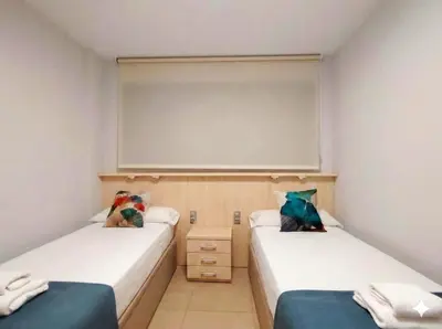 Cama o camas de una habitación en Romanilla Suites con vistas al mar, piscina y salida directa a la playa