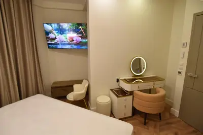 Una televisión o centro de entretenimiento en Resort Villa Las Palmeras