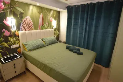 Cama o camas de una habitación en Resort Villa Las Palmeras