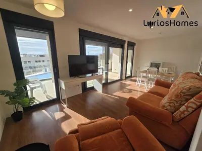 Una televisión o centro de entretenimiento en El Toyo - Maravilloso Apartamento Deluxe