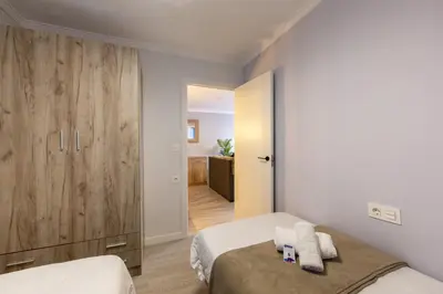 Cama o camas de una habitación en AlmeriaSuite El Zapillo Beach