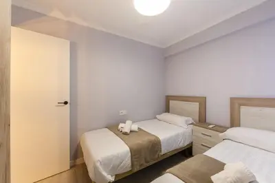 Cama o camas de una habitación en AlmeriaSuite El Zapillo Beach
