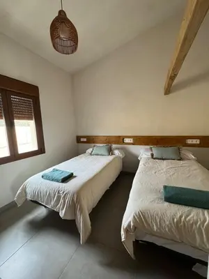 Cama o camas de una habitación en Villa Loma de Bas 1 y 2