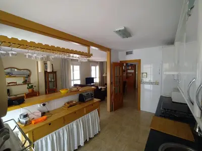 Una cocina o zona de cocina en Apartamento coqueto con terraza junto al mar