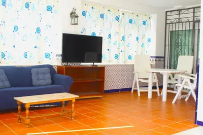 Una televisión o centro de entretenimiento en Villa Sol