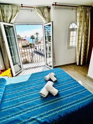 Cama o camas de una habitación en Hostal Cala Verde