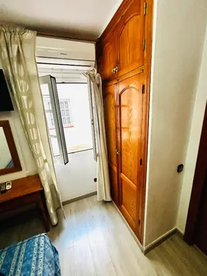 Cama o camas de una habitación en Hostal Cala Verde