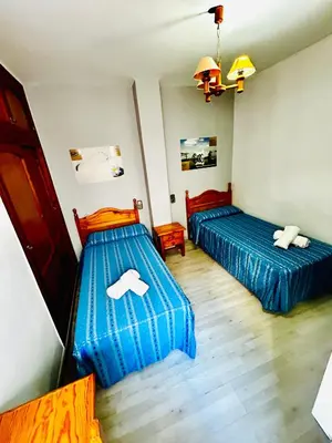 Cama o camas de una habitación en Hostal Cala Verde