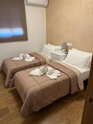 Cama o camas de una habitación en Hotel Mesón el 21
