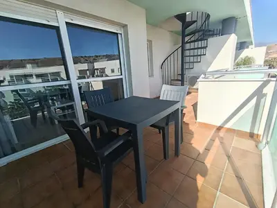 Un balcón o terraza de ALMERIMAR GOLF AND PoOL APARTMENT