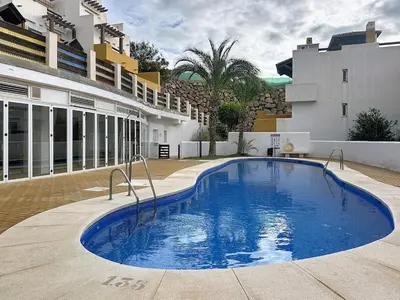 Piscina en o cerca de VVR Lomas de Mar Apto con terraza y piscina climatizada