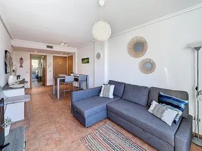 Zona de estar de VVR Lomas de Mar Apto con terraza y piscina climatizada