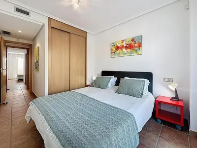Cama o camas de una habitación en VVR Lomas de Mar Apto con terraza y piscina climatizada