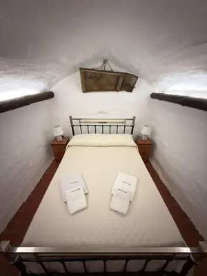 Cama o camas de una habitación en Casa Cueva Conde