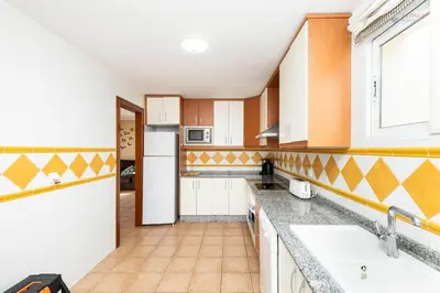 Una cocina o zona de cocina en Sunny penthouse with large terrace and pool in Vera