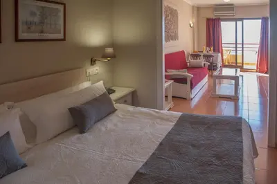 Cama o camas de una habitación en Apartahotel Aguadulce