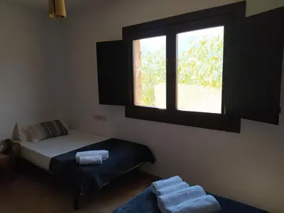 Cama o camas de una habitación en Hotel Rural La Marmita de Ahlam
